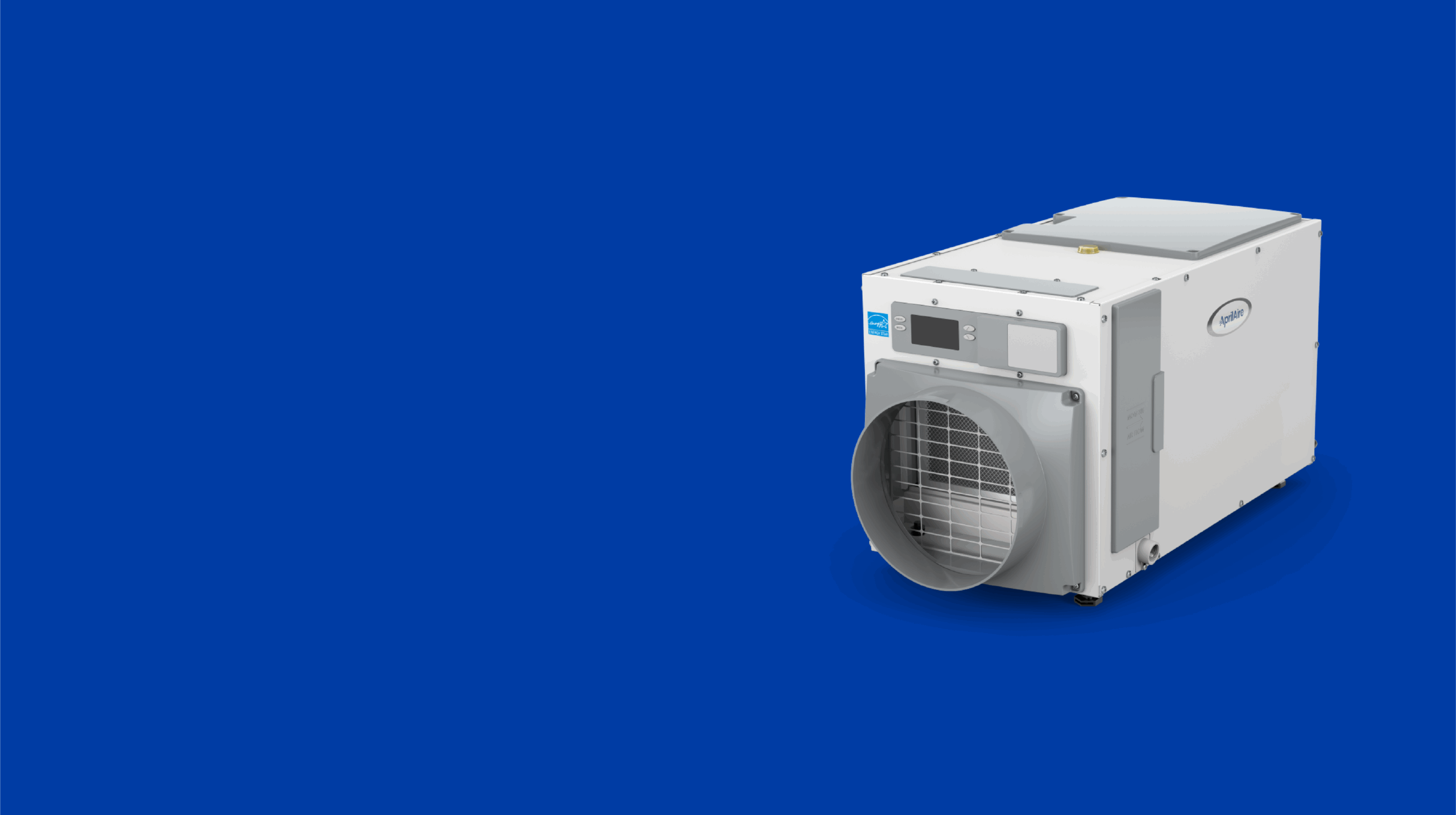 Aprilaire whole-house dehumidifier unit installed in a residential setting.